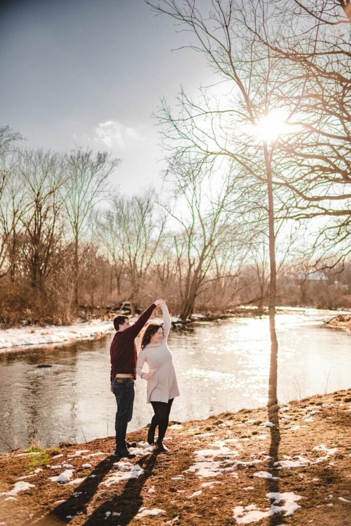 couple dancing next to the river