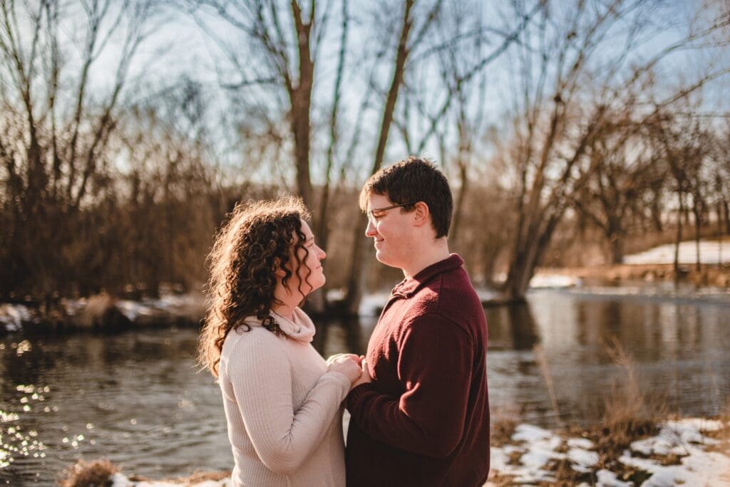backlit engagement photos with river