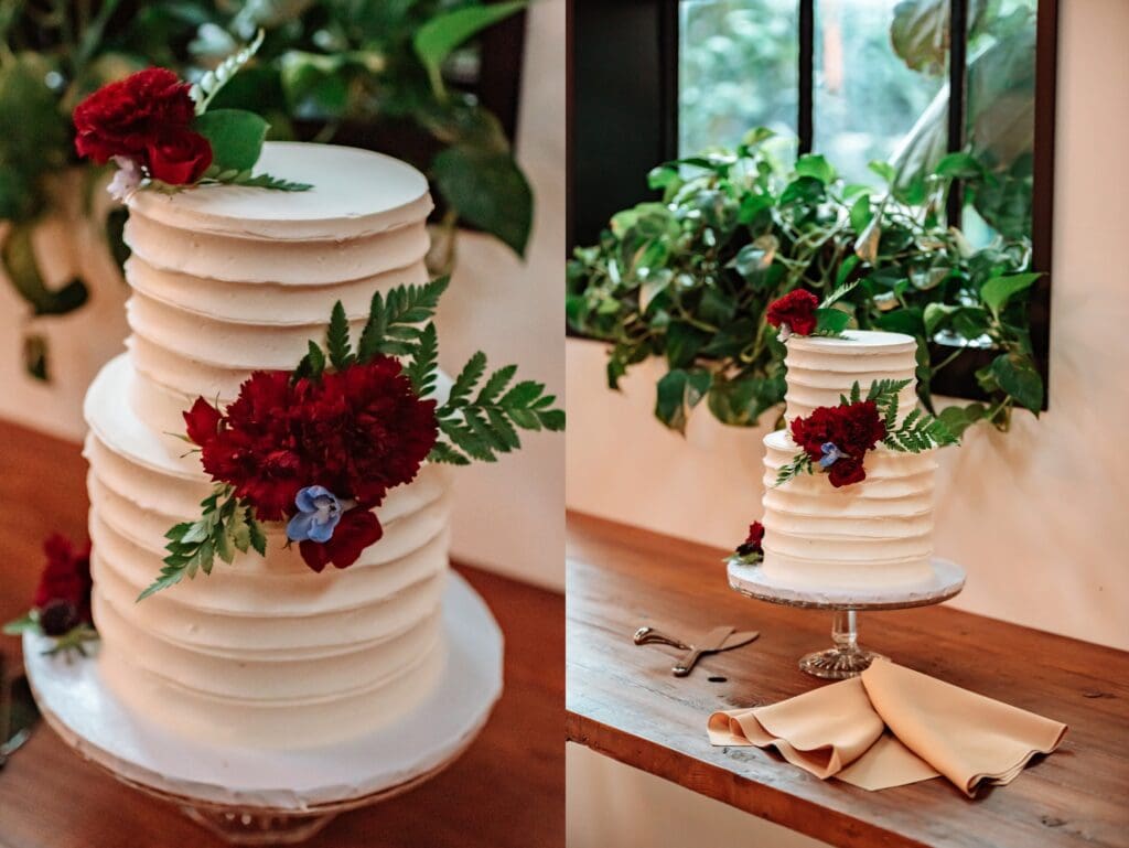 simple white wedding cake with fresh red flowers
