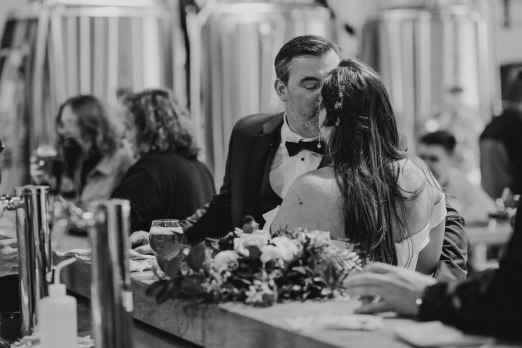 bride and groom go to a brewery for a beer