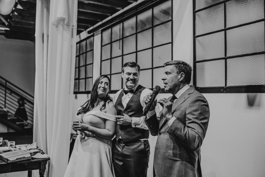 wedding toasts at indoor wedding reception in madison wisconsin