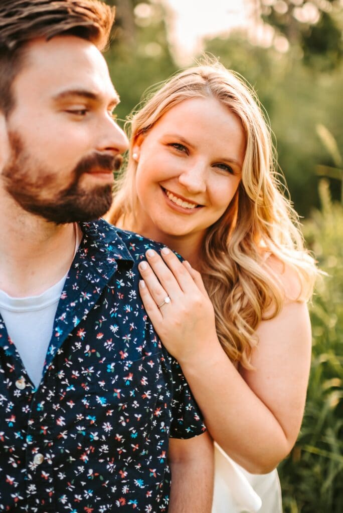 couple snuggled together for engagement photos