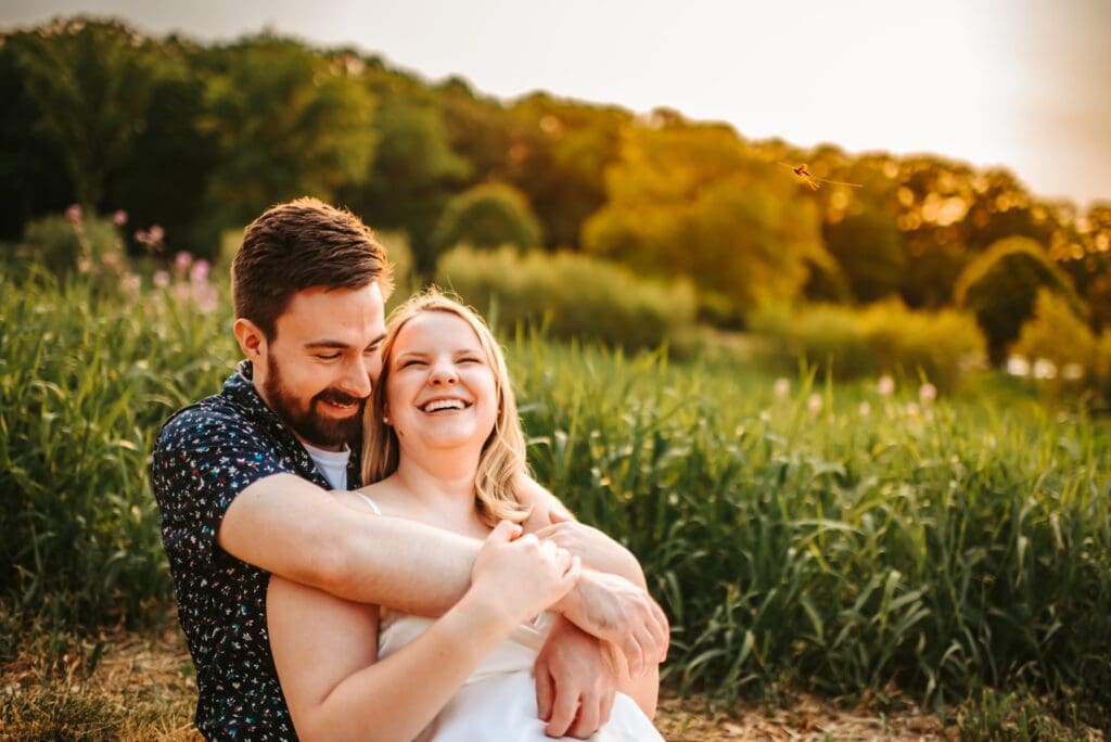 couple snuggled together for engagement photos