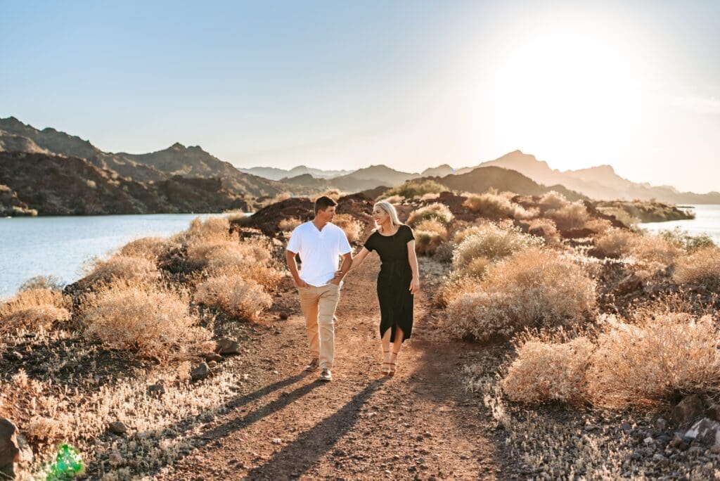 engaged couple walking together in the arizona desert
