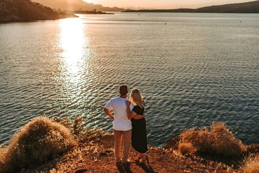 couple watching sunset together over the colorado river