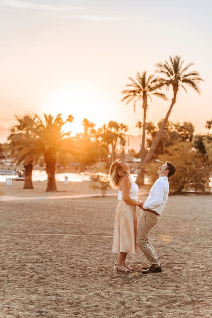 couple laughing together at engagement session