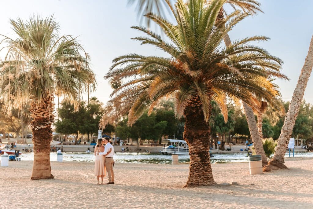 couple walking together at rotary park engagement session in lake havasu city