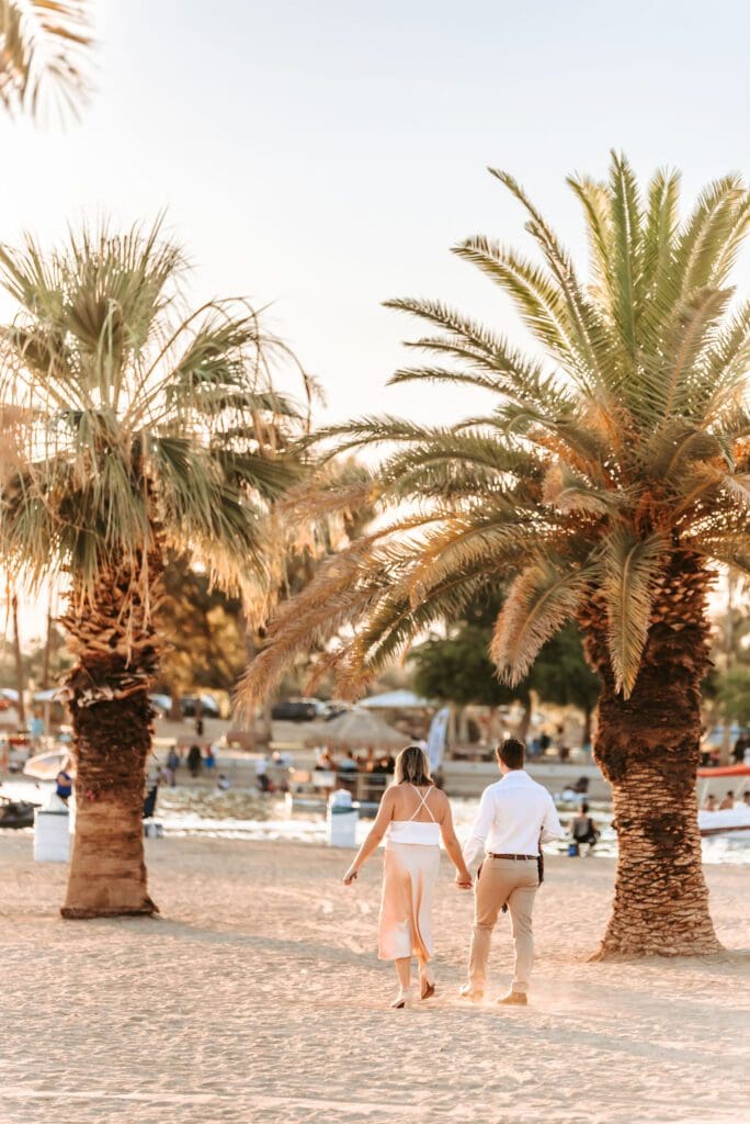 couple walking together at rotary park engagement session in lake havasu city