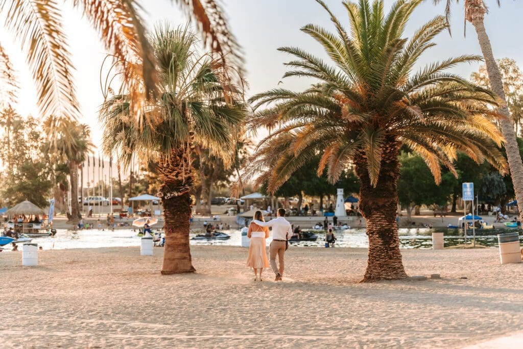 couple walking together at rotary park engagement session in lake havasu city