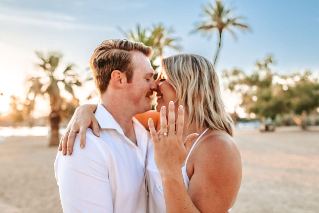 newly engaged couple showing off the ring