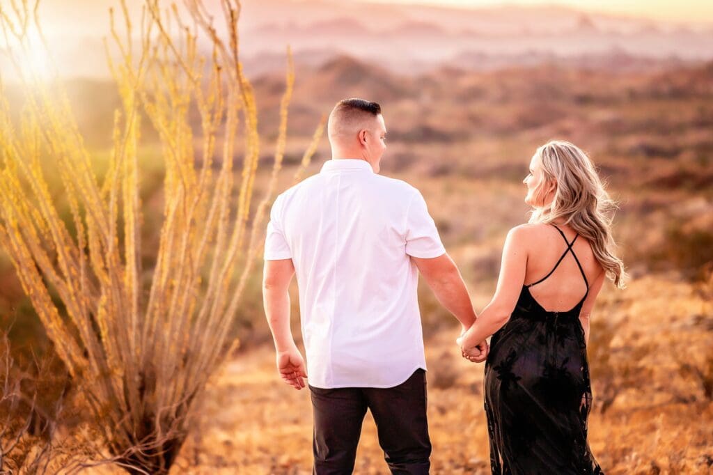 engagement photos in the desert with a mesquite bush