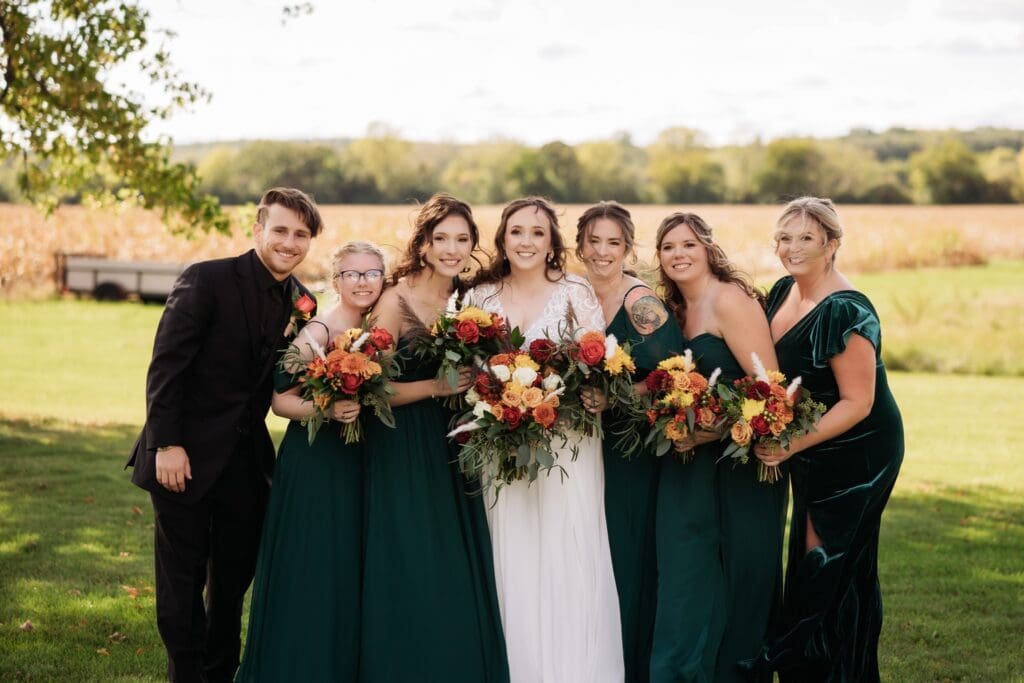 october wedding bridal party with green velvet bridesmaids dresses