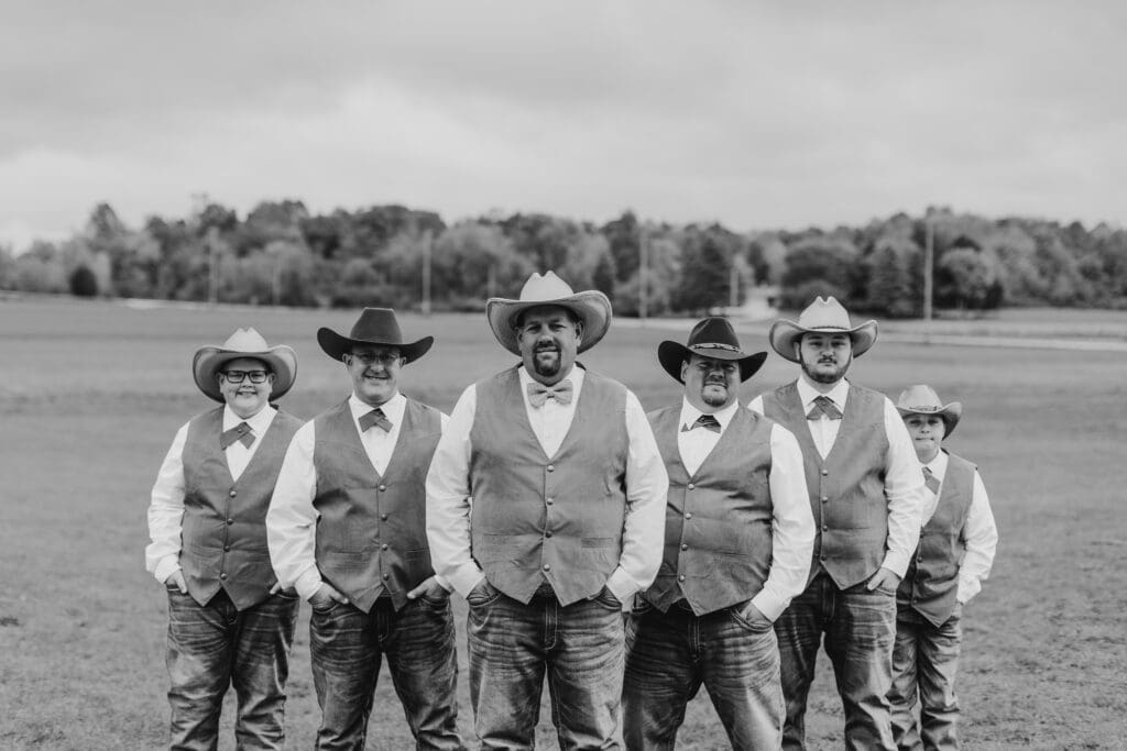 fall colored country wedding with cowboy hats and vests