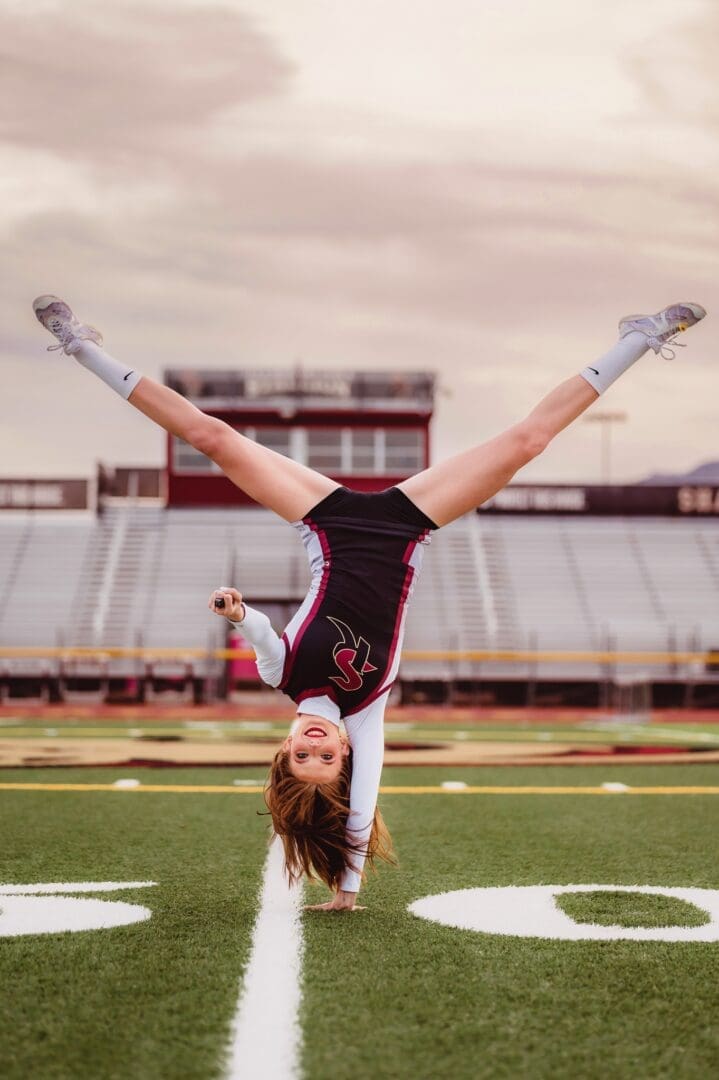 cheerleader pose for senior photos